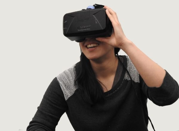 woman wearing black VR goggles